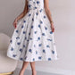 White sleeveless blue flower dress