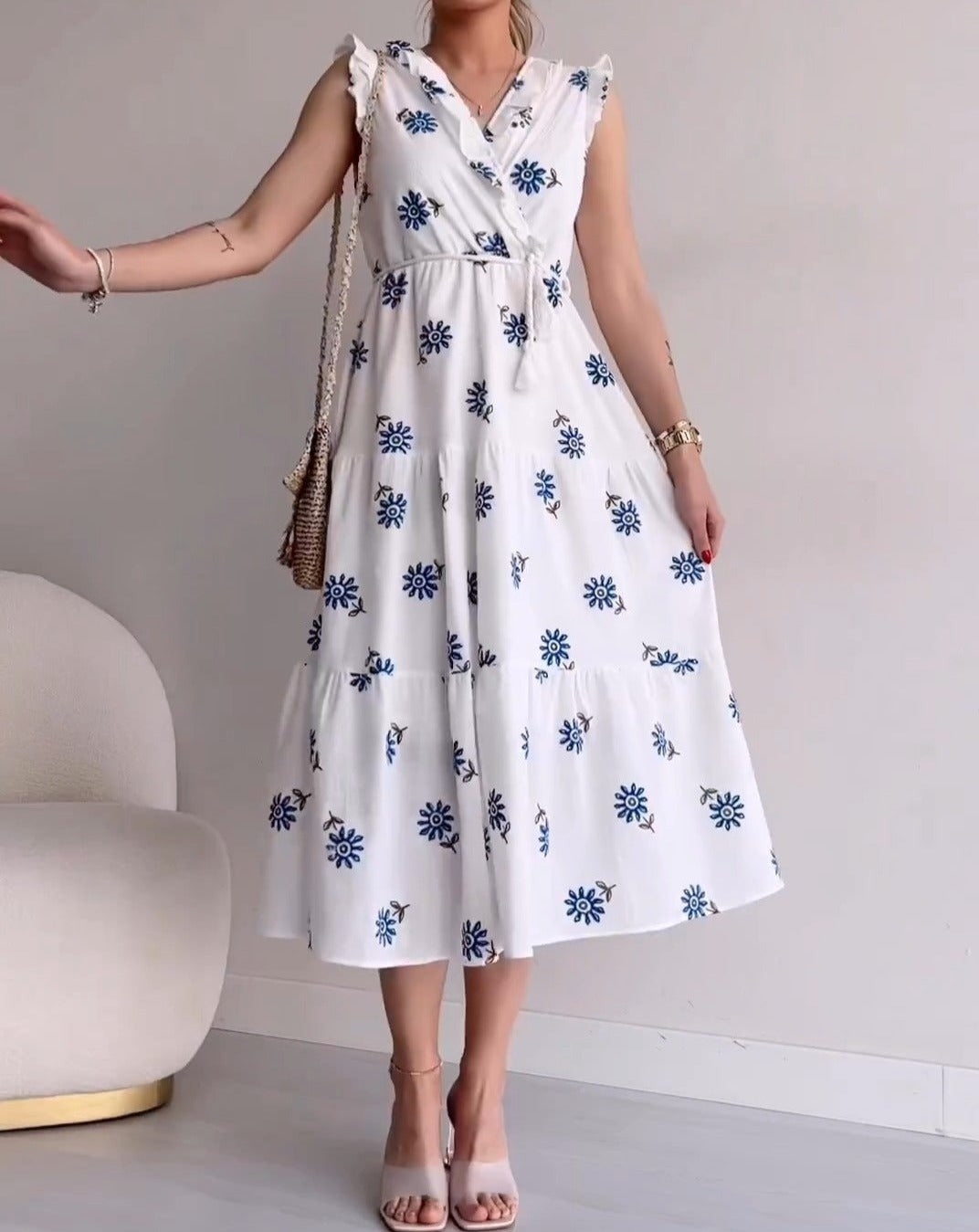 White sleeveless blue flower dress