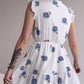 White sleeveless blue flower dress